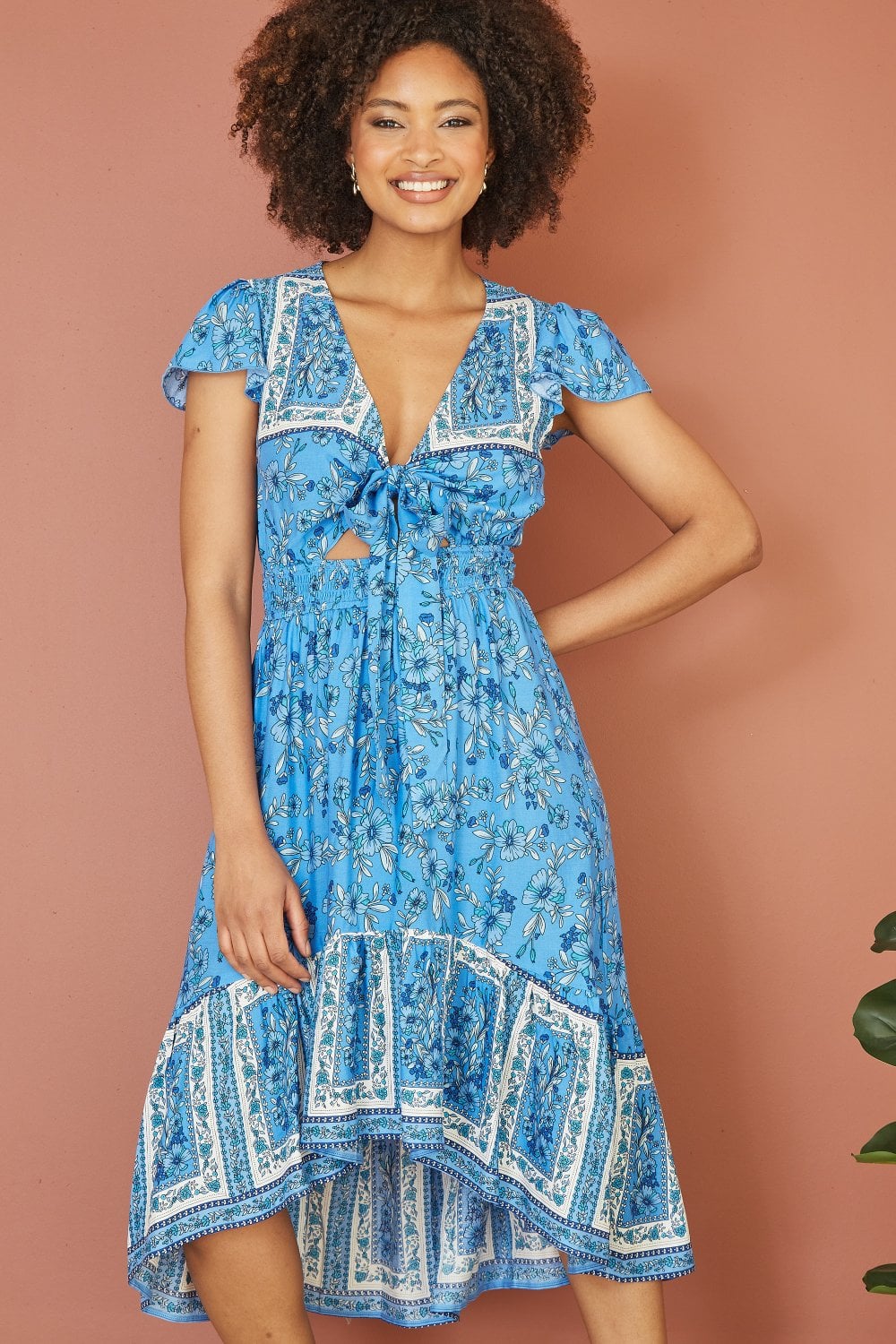 Mela Blue Ditsy Print Sun Dress With Cross Over Back Tie Front And Dip Hem