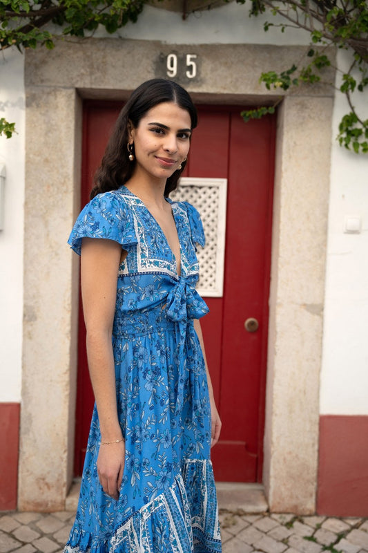 Mela Blue Ditsy Print Sun Dress With Cross Over Back Tie Front And Dip Hem