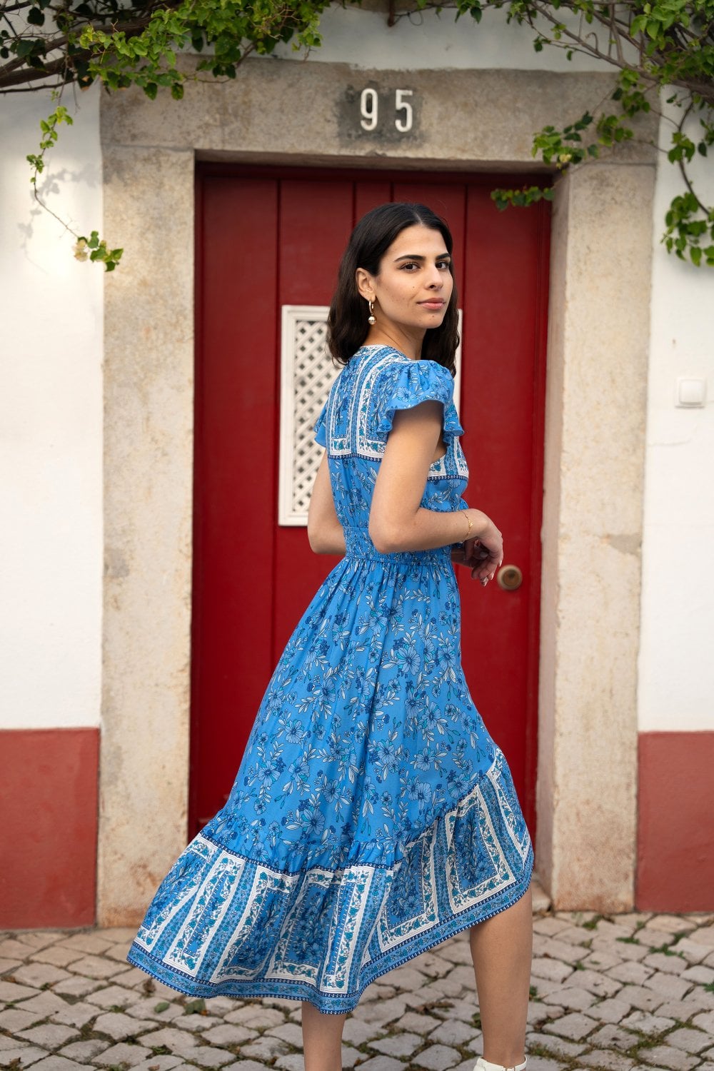 Mela Blue Ditsy Print Sun Dress With Cross Over Back Tie Front And Dip Hem