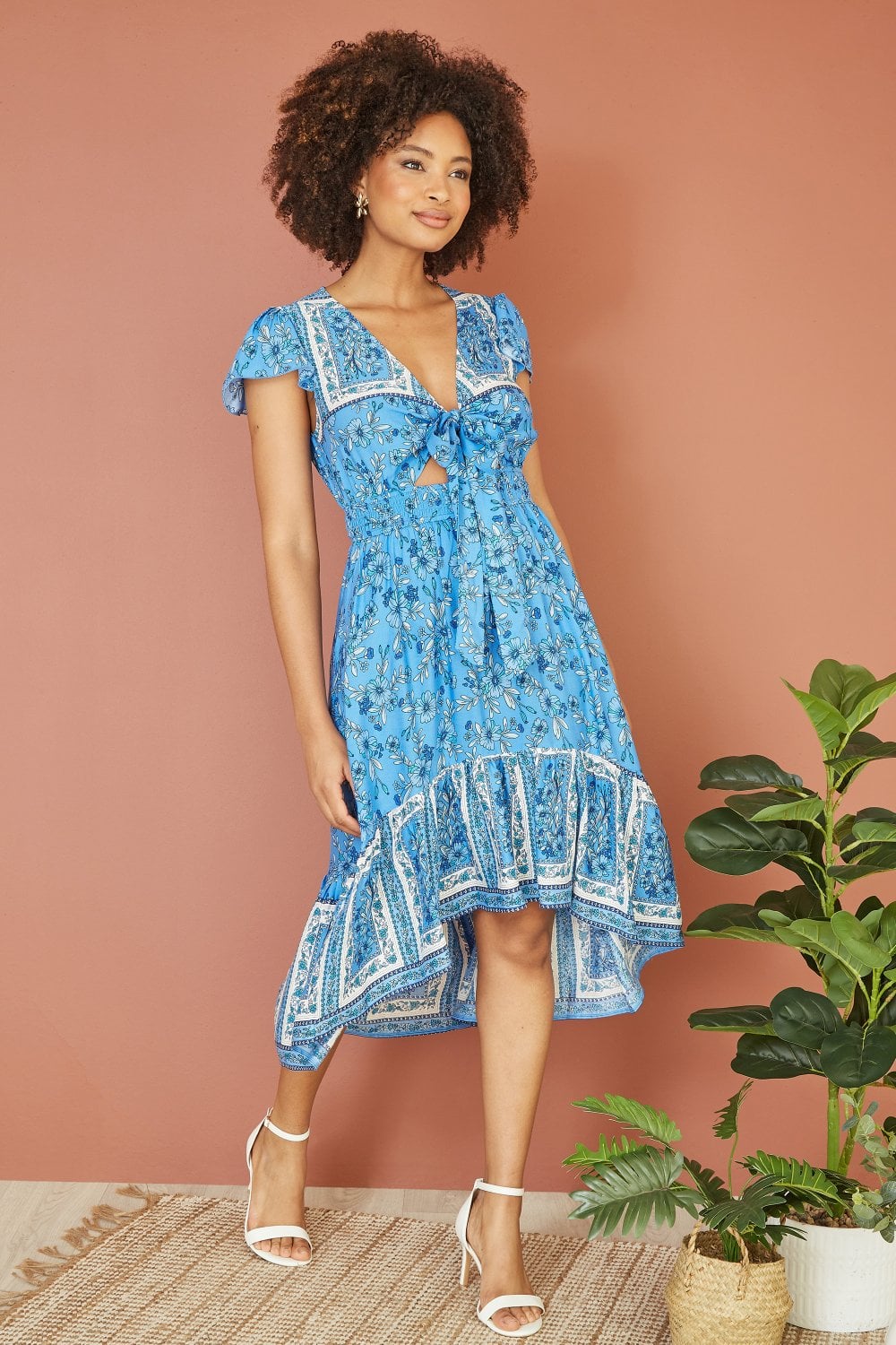 Mela Blue Ditsy Print Sun Dress With Cross Over Back Tie Front And Dip Hem
